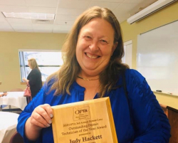 Judy Hackett with Award