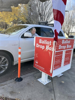 Voter dropping off ballot 2024