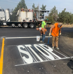 installation of pavement legends on Alfalfa Market Rd.