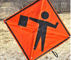 flagger ahead sign