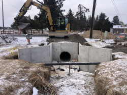 backfill work occurring at the canal crossing on Deschutes Market Rd.