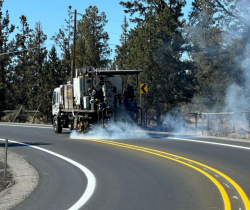 installation of pavement markings on Old Bend-Redmond Hwy.
