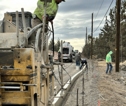 This week’s photo shows installation of concrete curbs occurring on Hunnell Rd.