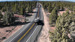Crews installing pavement markings on Hunnell Road