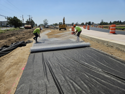 Crews working on Powell Butte Hwy and Butler Market Rd Roundabout, Aug. 2024