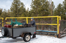 Photo of man unloading trailer at transfer station