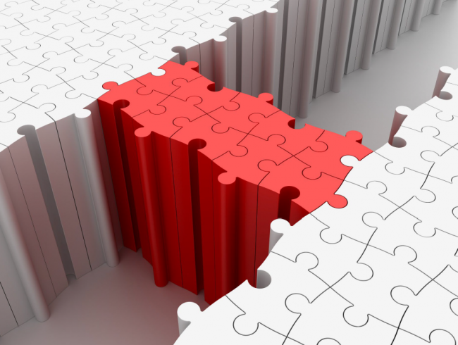 Image of puzzle pieces creating a bridge