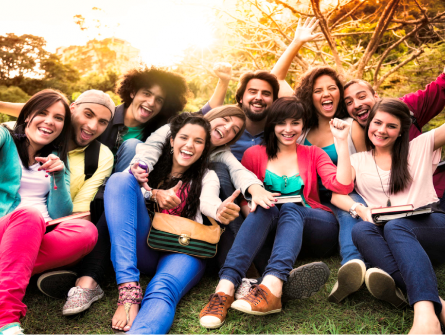 Image of a small group of young adults smiling 