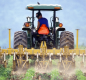 A farmer spraying pesticides image