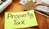 Sticky note with property tax reminder