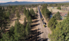 Aerial view of road paving on Tumalo Reservoir Road through a rural area.